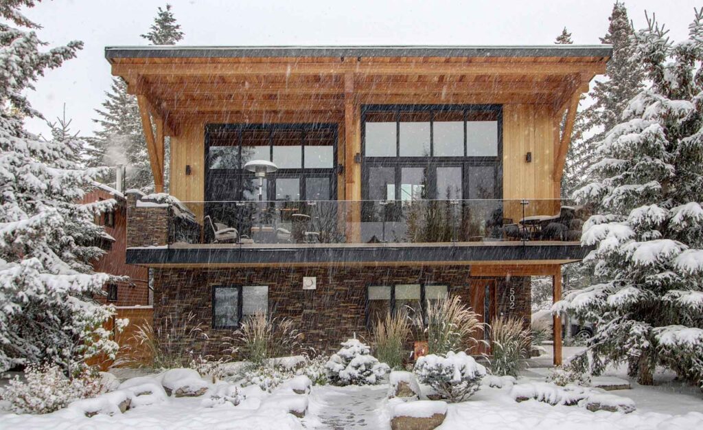 Snowy exterior of award-winning mountain home