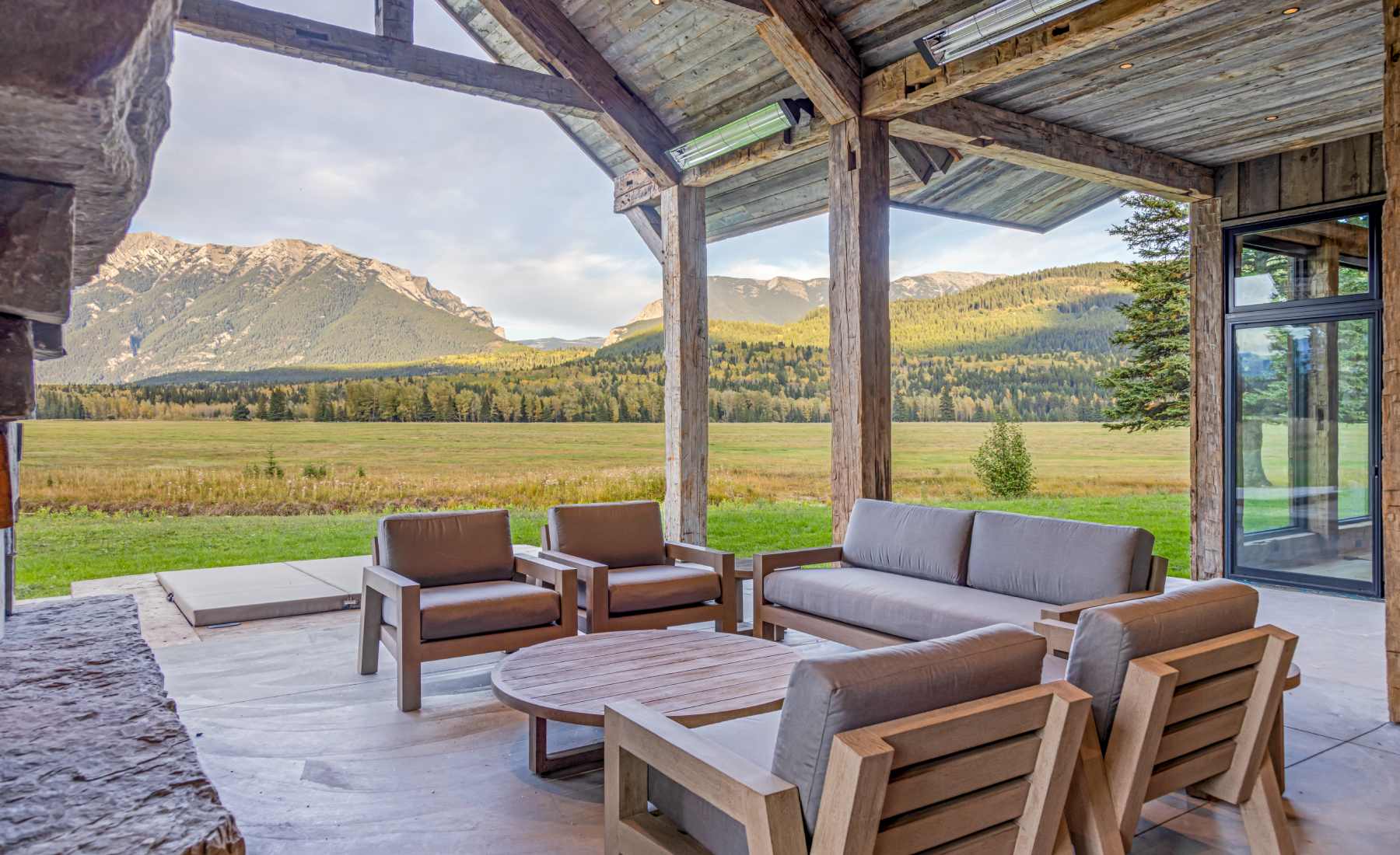 custom reclaimed timber porch with a mountain view